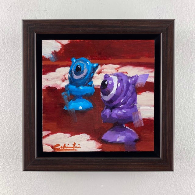 Little Aliens features two whimsical figures in vibrant hues of blue and purple, set against a warm, textured background....