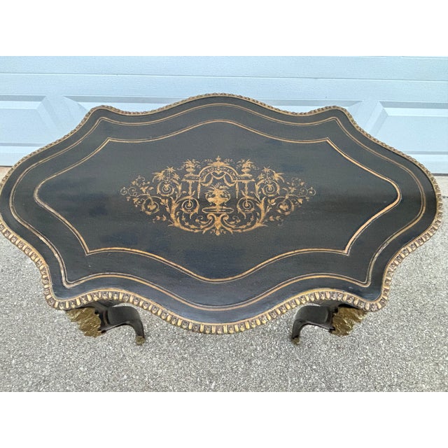 This stunning table is a versatile antique, being a great size for use as a center table, accent table, or small desk. It...