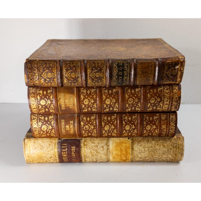 We are selling this great decorative French Tantalus bar set. This set is made to look like a stack of old leather bound...