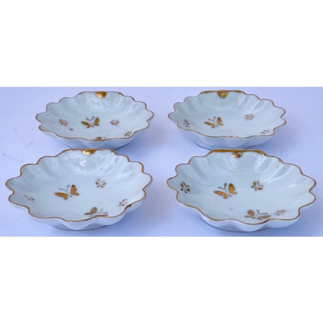 Charming little French shell-shaped porcelain salt cellars with gold butterflies and a gold rim. They can also be used for...