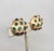Hard to find 1960s round domed textured goldtone with three slightly bigger cabochon faux-emeralds in the middle and...