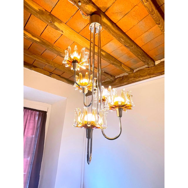 A beautiful chrome chandelier with five magnificent light, attributed Carlo to Nason Murano glass. In working condition,...