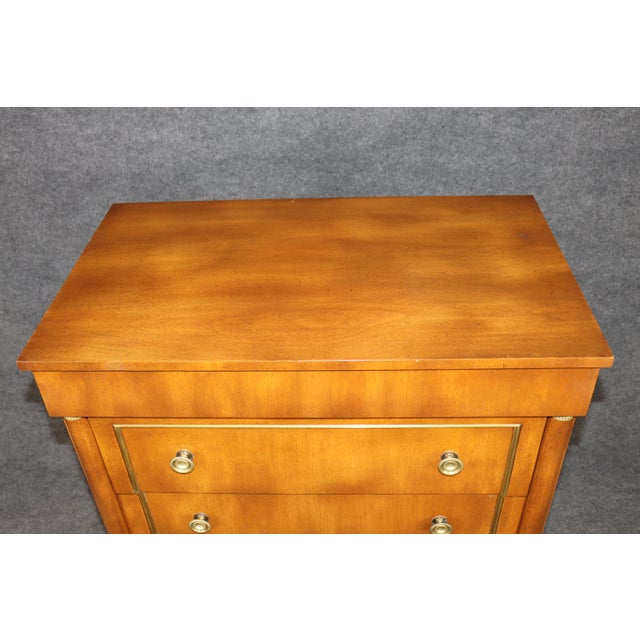 A handsome and beautifully proportioned French Empire-style tall chest, dating to approximately the 1950s or 1960s,...
