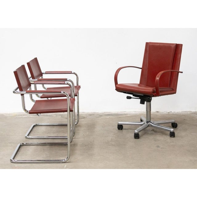 Set of three chairs made by the historic matteo grassi manufacturer, consisting of a swivel executive chair with armrests...