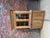 This raw beech dresser has been completely restored. It consists of an upper section with two glass doors opening onto two...