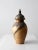 This signed vintage studio pottery vase features a dynamic, hand-crafted urn form with a bold drip glaze cascading from...