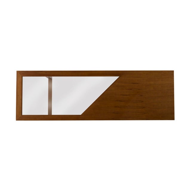 This unique dining table was designed by Angela Harris. It is crafted of suar wood, metal and glass. Color and character...
