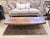An exceptional vintage Mid Century Modern coffee table showcasing the refined artistry of finely matched walnut veneers...
