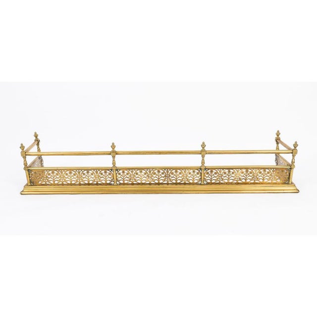 This is a superb Victorian brass fireplace fender/guard, circa 1860. The fender has a moulded fixed base with turned...
