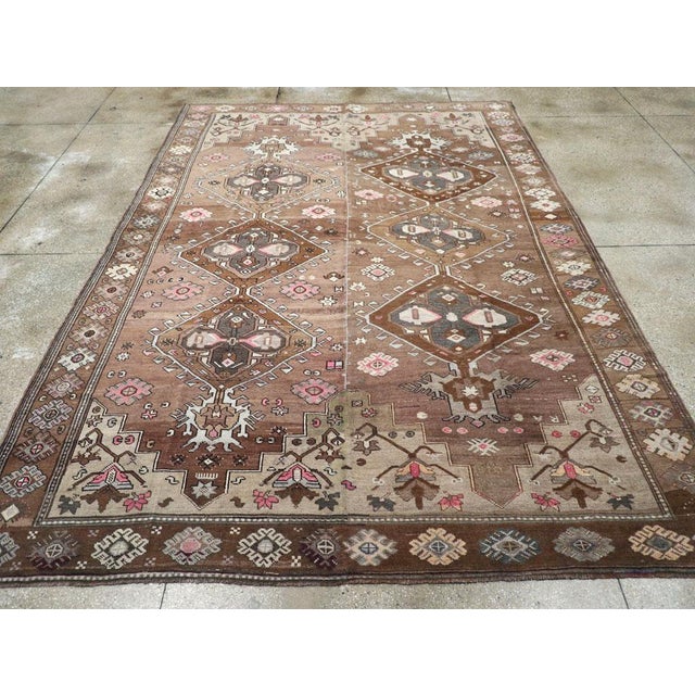 A vintage Turkish Anatolian tribal room size carpet handmade during the mid-20th century. Measures: 8' 11" x 12' 7"