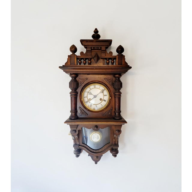 This elegant antique wall clock was made by Junghans, one of Germany’s most important and respected clock manufacturers,...