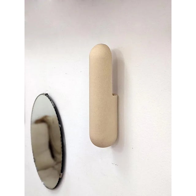 Almond small kyrtos wall light by lisa allegra dimensions: w 8 x d 8 x h 30 cm materials: clay up to 250v (europe/uk...