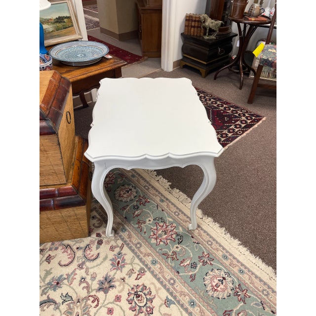 Dated from mid 20th century. Elegant Louis XV style side table. Made in Italy. Wooden table repainted white. A great...