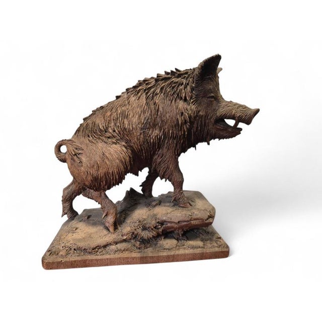 Rare and highly decorative 19th-century carved wooden sculpture representing a warthog, executed in solid wood with...