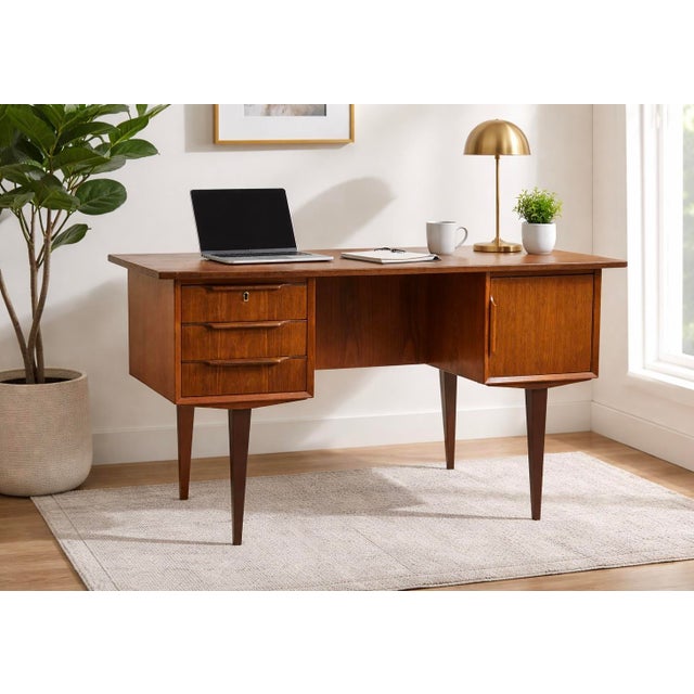 Mid Century Modern Danish Teak Double Sided Desk, Made in Denmark, circa 1960s. This beauty offers three dovetailed...