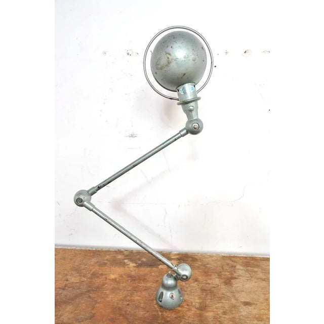 Original 2-armed Jieldé with the well-known hinge points (patented). The design is by Jean-Louis Domecq for Jieldé. The...