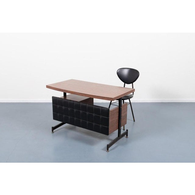 Small Italian desk with laminated top and gallon upholstery on the front. Equipped with 2 drawers module on the right,...