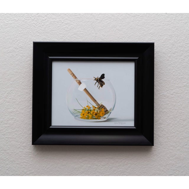 This artwork depicts a delicate glass bowl containing vibrant yellow flowers and a wooden honey dipper, alongside a...