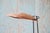 A 1950s Floor lamp designed by Mitchell Bobrick For Controlight. Sculptural, featuring a birch base, ceramic cone body,...