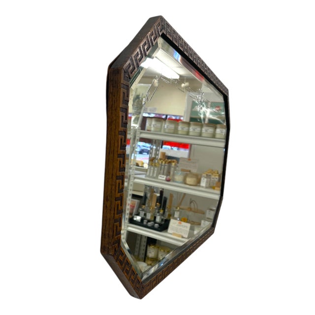 A vintage Art Deco-era mirror imported from the United Kingdom, featuring a distinctive octagonal silhouette and a richly...