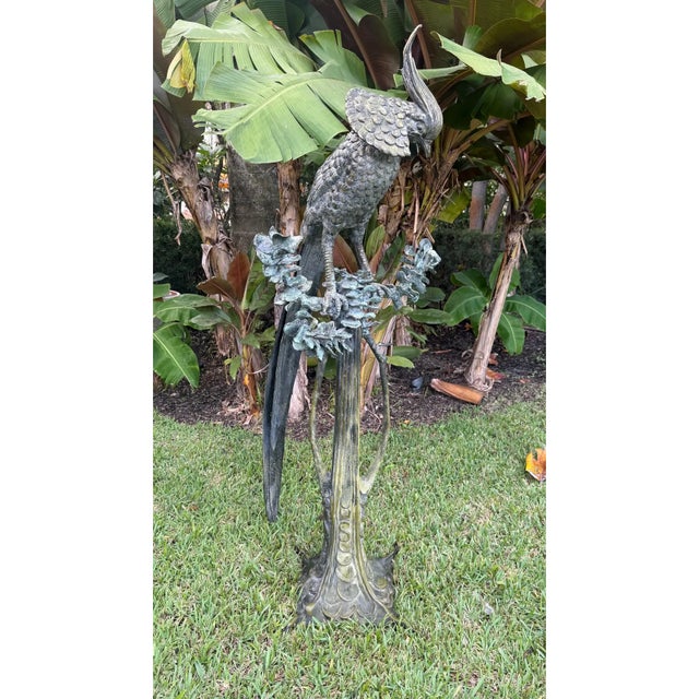 A dramatic, monumental bronze phoenix sculpture signed P. J. Moser. Standing an impressive 68 inches tall and weighing...