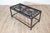 This unique coffee table repurposes antique French balcony railings into a striking piece of functional art. The tabletop...