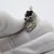 This delicate miniature pendant depicts a detailed newborn shoe, handcrafted in Arezzo, Tuscany during the 1970s/1980s....
