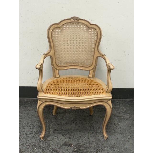 Design Plus Gallery presents a Louis XV Style Cane Armchair, Antique. This armchair has a shaped crest rail, scroll arms,...