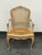 Design Plus Gallery presents a Louis XV Style Cane Armchair, Antique. This armchair has a shaped crest rail, scroll arms,...