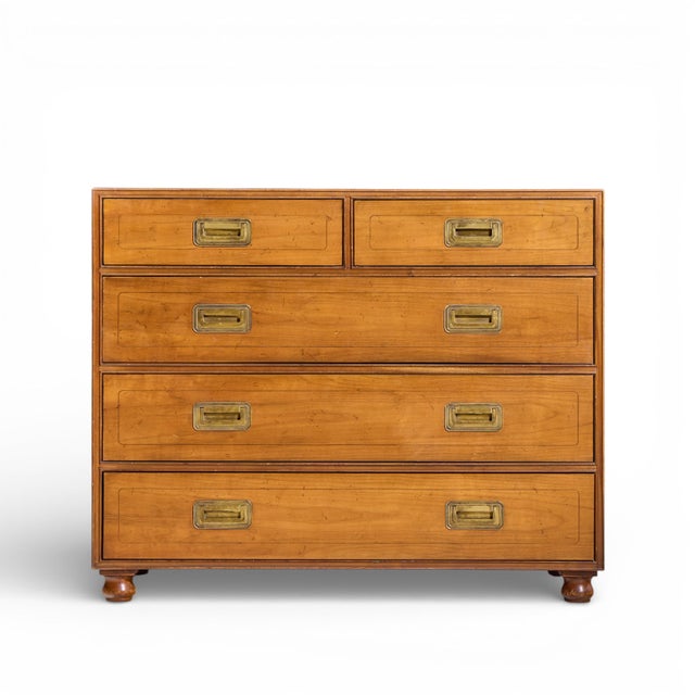 Baker Cherry and Brass Campaign 5 Drawer Dresser This highboy measures: 38 wide x 19 deep x 30.75 inches high ABOUT...
