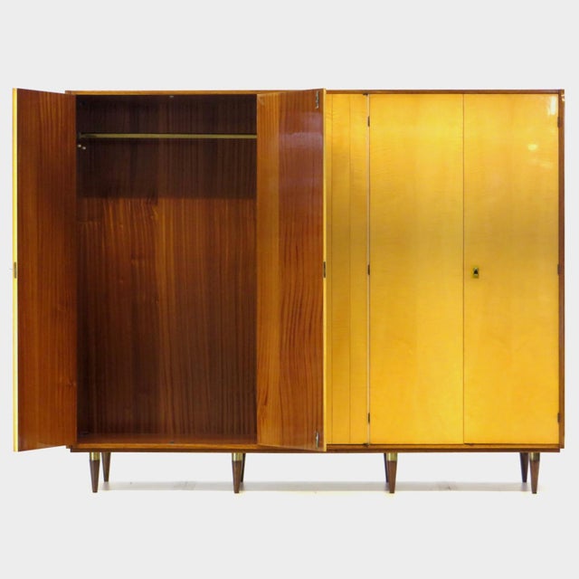 This large 5-door mid century modern design wardrobe features an unique woodgrain pattern of flamed maple combined with...