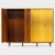This large 5-door mid century modern design wardrobe features an unique woodgrain pattern of flamed maple combined with...