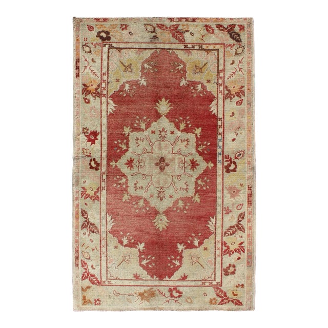 Mid 20th Century Red Field Vintage Turkish Oushak Rug With Geometric Medallion and Floral Motifs For Sale