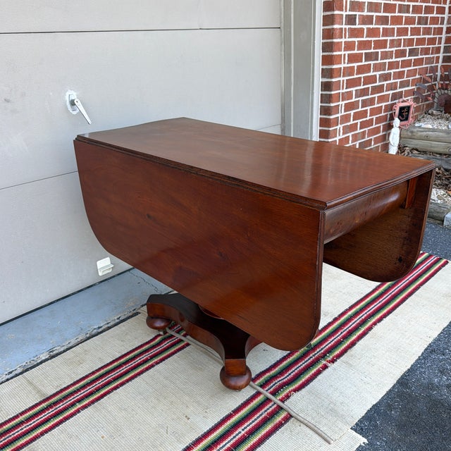 Antique Mahogany Empire Drop Leaf Breakfast Table, New England, Circa 1840s A handsome and well-proportioned example of...