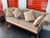 This style of sofa represents traditional American or European furniture design popular from the late 19th through the...