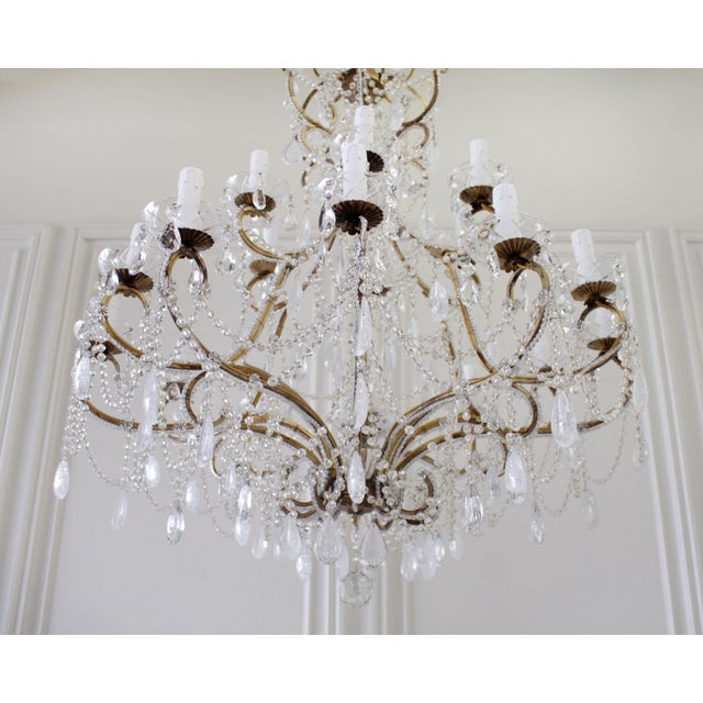 Antique reproduction Italian chandelier with rock style crystals This beautiful reproduction was designed by Full Bloom...