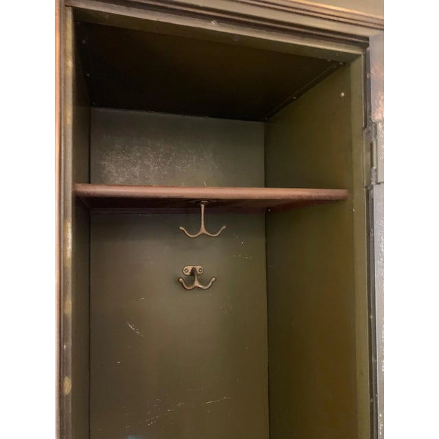 This very heavy iron and bronze detailed tall locker with black Belgian marble base is all original. Interior details...