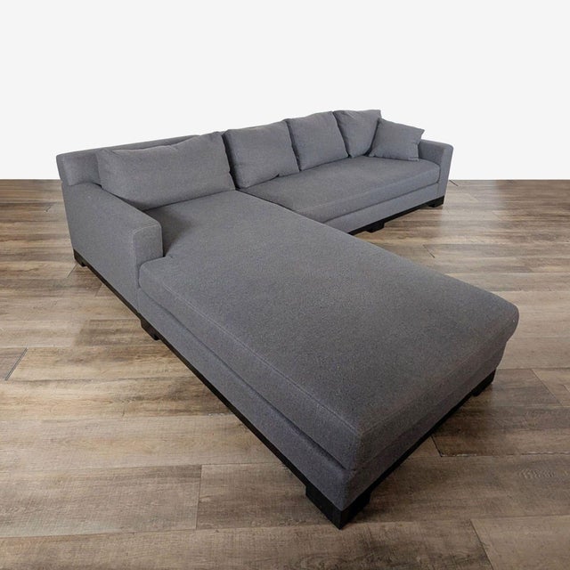 Gray, L-shaped sofa with a chaise lounge. Brand: Fitzgerald. Dimensions (in): 120W x 40D x 30H.