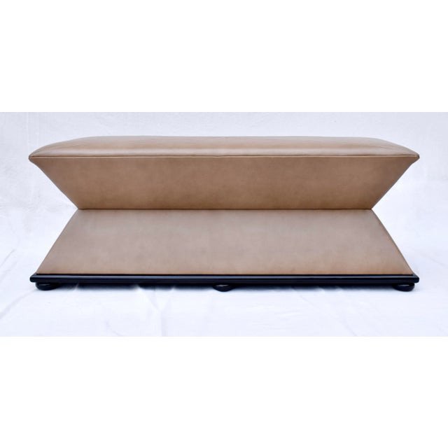 Generously sized classic hourglass shape bench or ottoman possessing distinct French Modernist sculpture design...