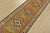 A tribal Caucasian Kazak runner hand-knotted with fine wool on a cotton foundation. This rug features a row of geometric...