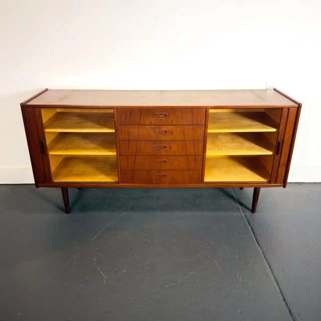 This lovely Danish sideboard is being offered as-is. The top does show sign of wear and some discoloration and this is...