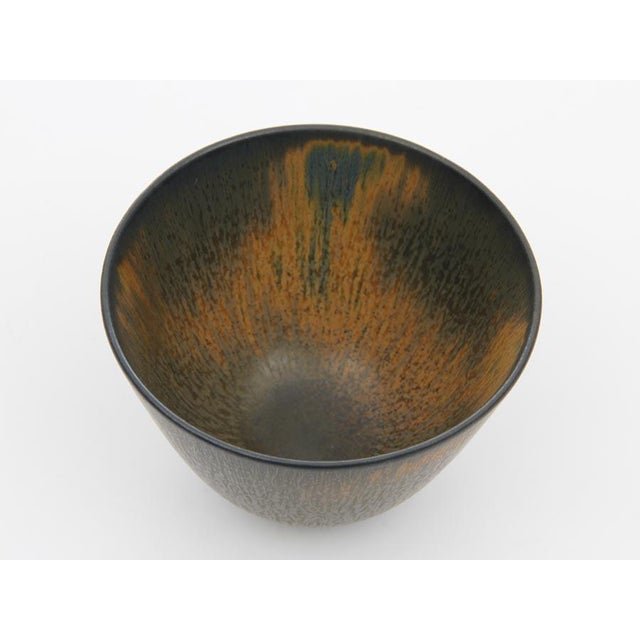 The scratch through the rorstrand 'r' indicates that the bowl is a factory 2nd. It appears to be either that there are a...
