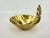 A beautiful vintage detail. The swimming dolphins motif brings a sense of joy and movement to the brass trinket dish,...