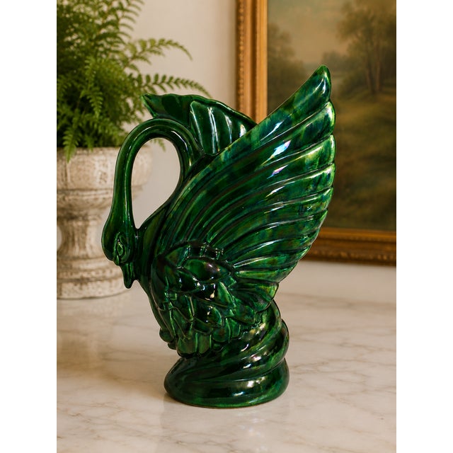 Beautiful vintage Royal Haeger swan vase featuring a rich emerald green glaze accented with deep blue undertones that...