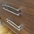 Wood Walnut Credenza Inverted Boomerang Top and Original Cadillac Chrome Pulls For Sale - Image 7 of 12