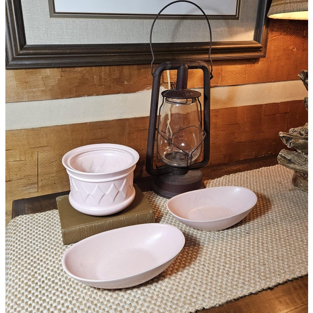 Showcase timeless is this mid-century, set of 3 Hyalyn Porcelain Bowls in soft pink. This charming trio includes two sleek...