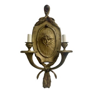 Antique Ornate Bronze French Empire Style Garland Sconce With Versace Style Sunface Detail For Sale