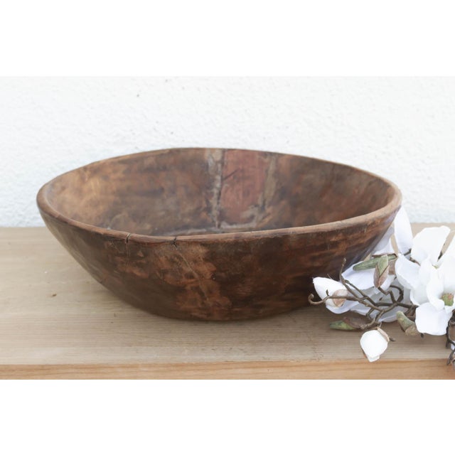 There is a soulful weight to this old wooden bowl that only comes with age. Originally hand-carved and likely used in a...