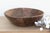 There is a soulful weight to this old wooden bowl that only comes with age. Originally hand-carved and likely used in a...