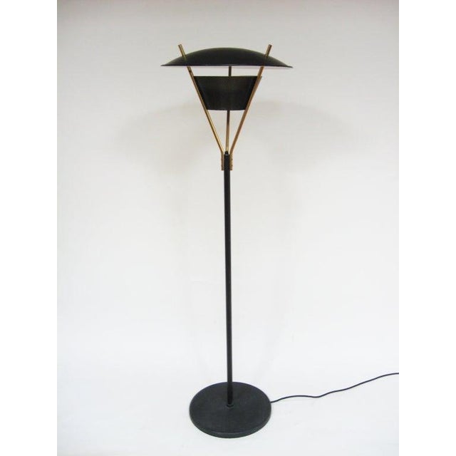 This great floor lamp is architectural with a restrained playfulness, it employs innovative materials (perforated steel)...